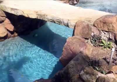 Boulders, Rocks and Stone Bridge Over Pool